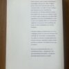 Achterkant van het 191 pagina's tellende paperback kookboek Grenzeloos koken met Adecco